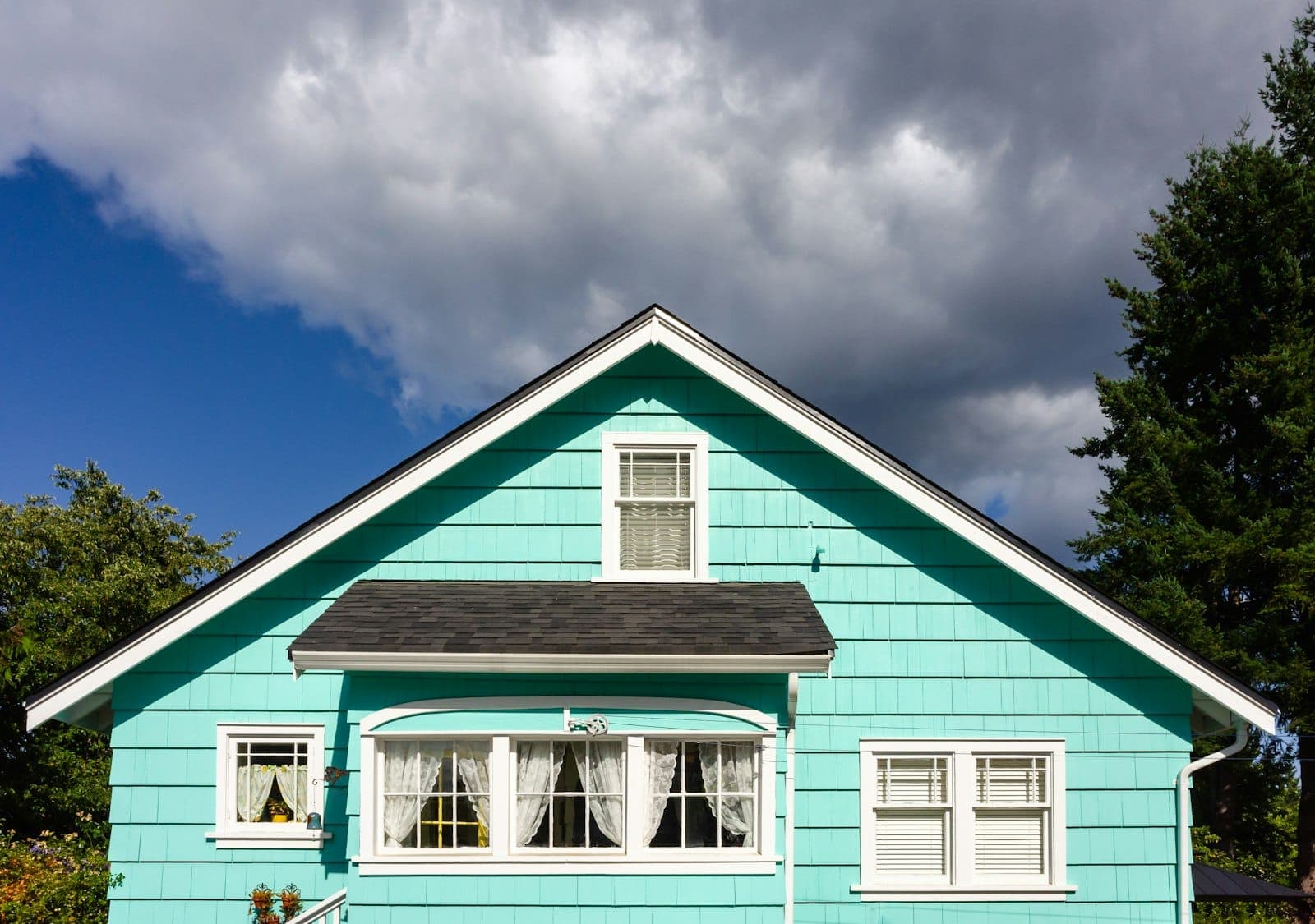 Blue lap siding with crisp white window trim